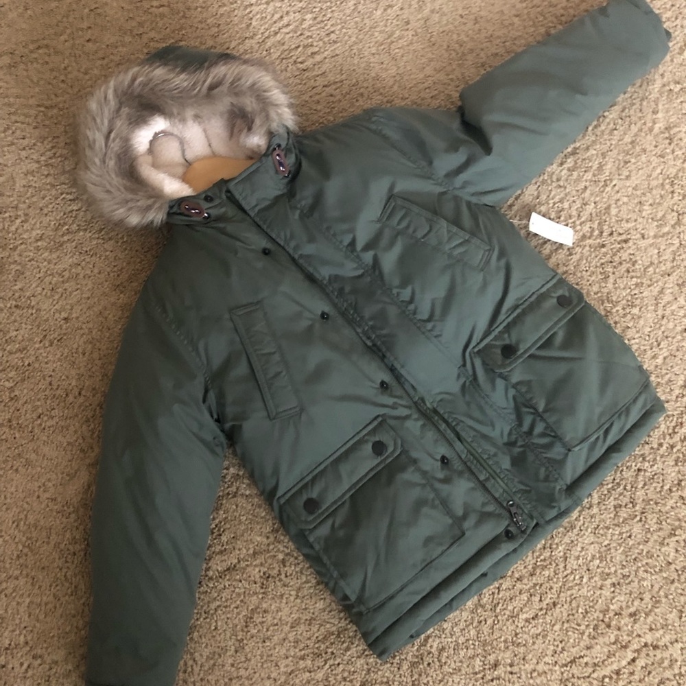 Army green puffer jacket with faux fur hood.